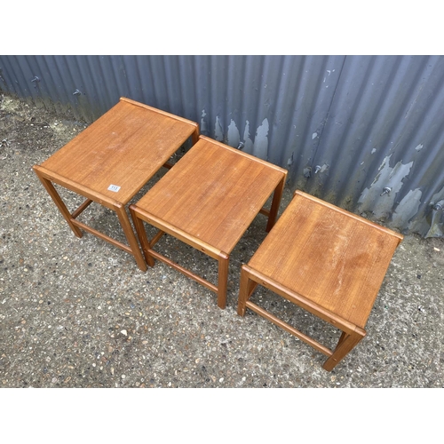 113 - A teak nest of three tables