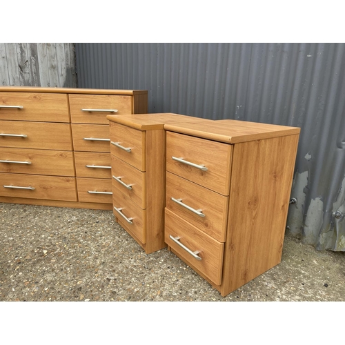 115 - A modern chest of 8 drawers together with matching pair of three drawer bedsides