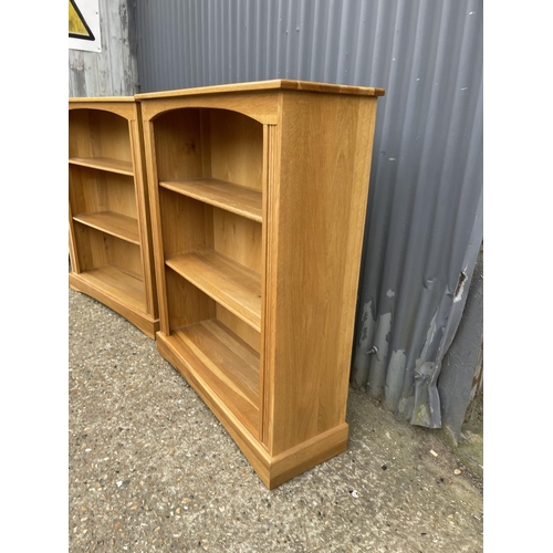 116 - A matching pair of light oak open fronted bookcases 95x30x 110 each