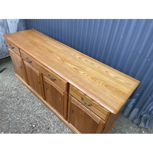 118 - A larger light oak modern 180x50x80 sideboard