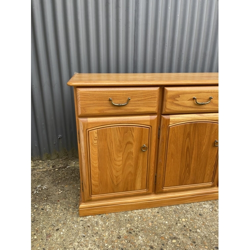 118 - A larger light oak modern 180x50x80 sideboard