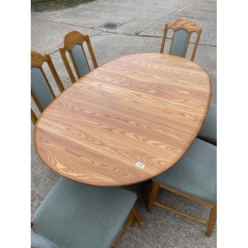 119 - A modern light oak extending oval dining table together with a set of six light oak dining chairs 18... 