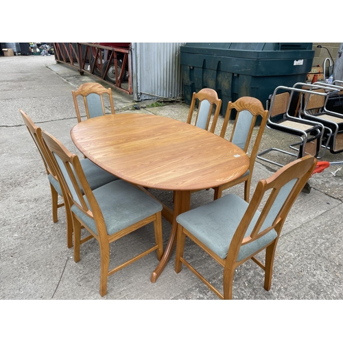 119 - A modern light oak extending oval dining table together with a set of six light oak dining chairs 18... 