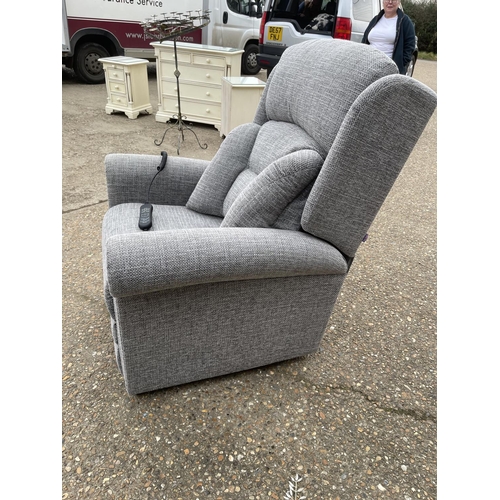 126 - A modern grey upholstered electric rise and recline armchair