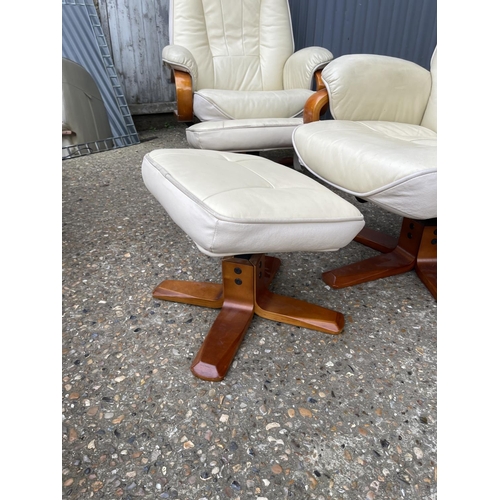 127 - Pair of cream leather easy chairs with matching footstools