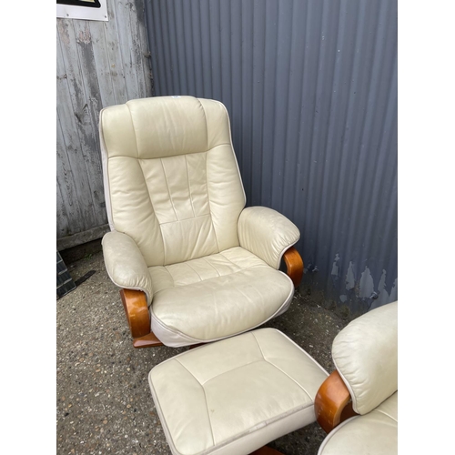 127 - Pair of cream leather easy chairs with matching footstools