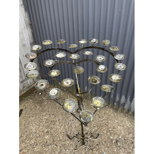 137 - A modern metalwork heart shaped candle holder on telescopic tripod stand