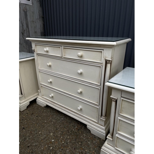 138 - A french style white painted chest of five drawers together with pair of matching three drawer bedsi... 