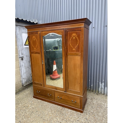 20 - An Edwardian mahogany inlaid wardrobe with mirror door 153 x52x197