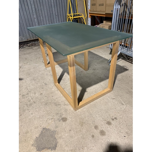 206 - Modern oak glass topped table, 138 x 80 x 75cms