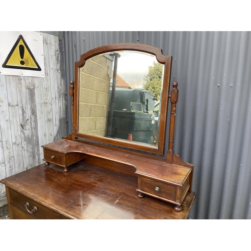 21 - An Edwardian mahogany dressing table with satinwood inlay