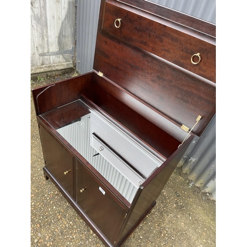 226 - A stag minstrel cocktail cabinet with mirror interior