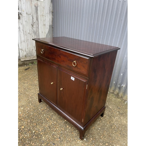 226 - A stag minstrel cocktail cabinet with mirror interior