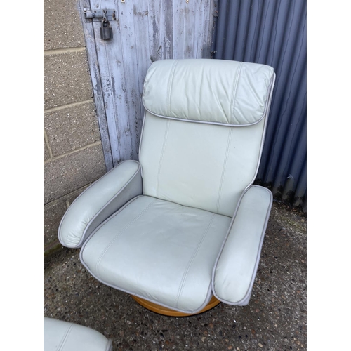 240 - A pair of grey leather reclining easy chairs with stools