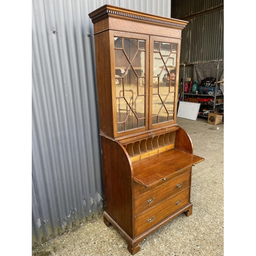 25 - A Victorian oak cylinder front oak bureau bookcase  with fitted interior 84x 50x106