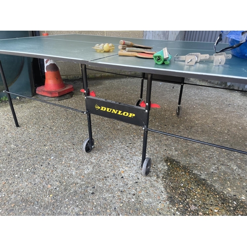 252 - A large Dunlop fold down table tennis table  with bats, balls and net