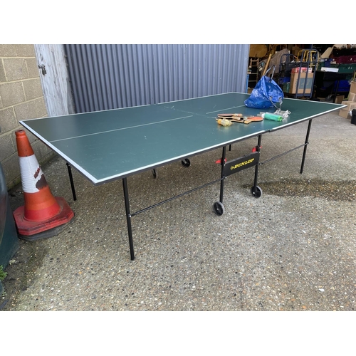 252 - A large Dunlop fold down table tennis table  with bats, balls and net