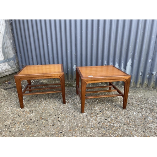 27 - A pair of mid century teak side tables