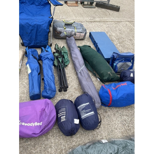 273 - A large collection of camping items including folding chairs, tables, tents, bbqs and sleeping bags