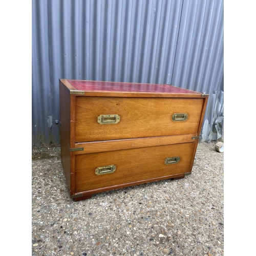 28 - A reproduction mahogany military style chest of two with red leather top  80x42x60