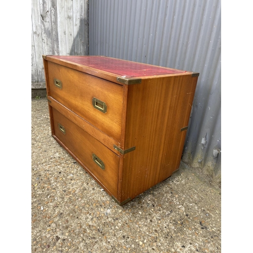 28 - A reproduction mahogany military style chest of two with red leather top  80x42x60