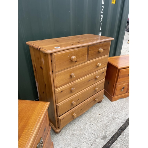 291 - A pine chest of drawers together with a pair of solid pine bedsides