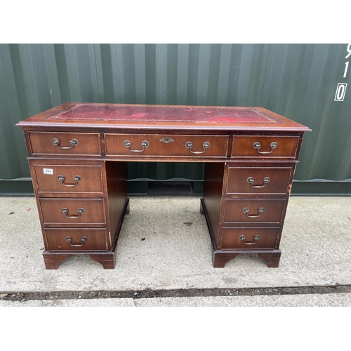 294 - A reproduction mahogany pedestal desk with red leather top