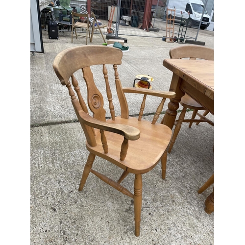 299 - A solid pine farmhouse dining table 181x90 together with a set of 8 farmhouse pine dining chairs inc... 