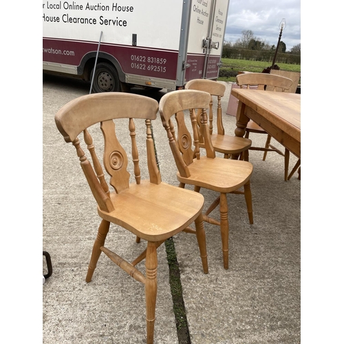 299 - A solid pine farmhouse dining table 181x90 together with a set of 8 farmhouse pine dining chairs inc... 