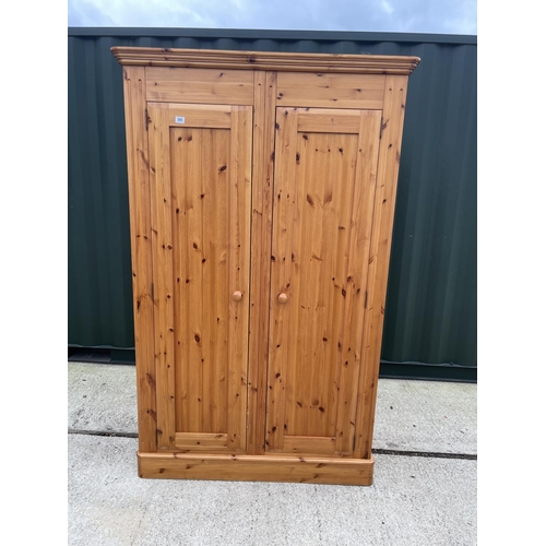 300 - A solid pine double wardrobe (can split down the center) 118x57x195