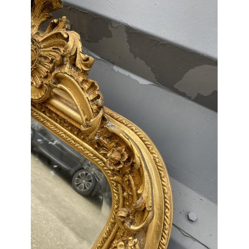 318 - A pair of very large ornate gold gilt mirrors with bevelled glass each 84x160