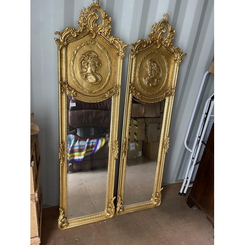 321 - A pair of gold gilt gilt framed hall mirrors each with lady head decoration facing each other each 4... 