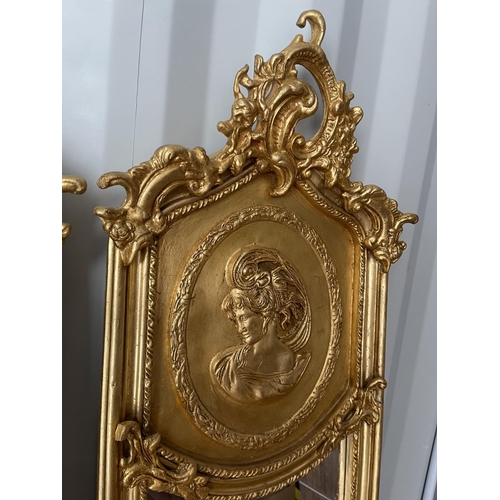 321 - A pair of gold gilt gilt framed hall mirrors each with lady head decoration facing each other each 4... 