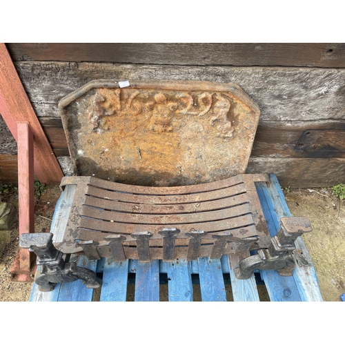 325 - A large heavy iron fire back dated 1629 86 x 58 together with iron basket and dogs 100cm wide