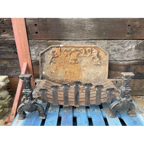 325 - A large heavy iron fire back dated 1629 86 x 58 together with iron basket and dogs 100cm wide