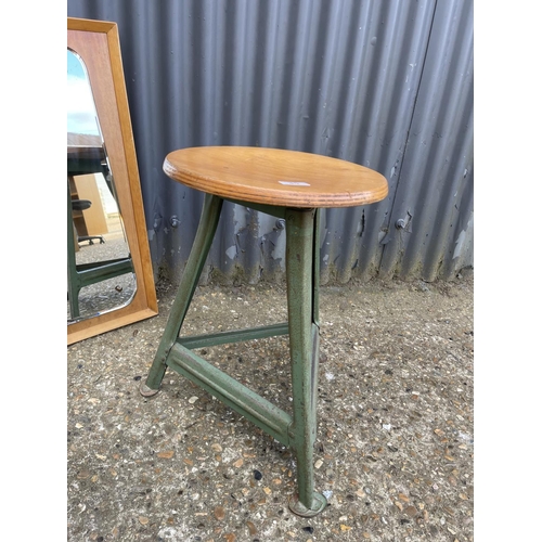 35 - A mid century industrial swivel stool together with a retro mirror