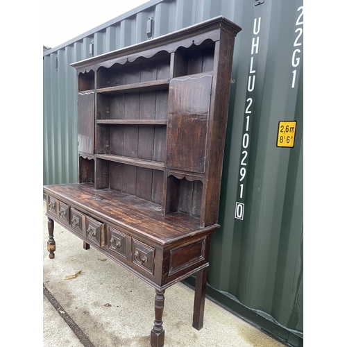 353 - An antique oak three drawer dresser with plate rack back 185x 56x 200