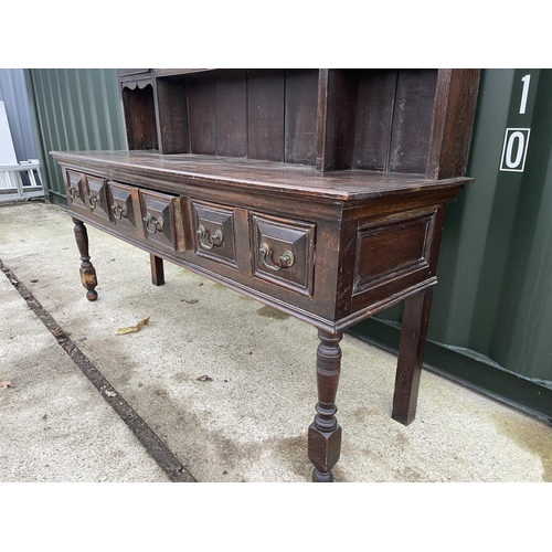 353 - An antique oak three drawer dresser with plate rack back 185x 56x 200