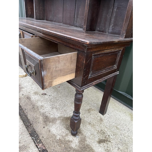 353 - An antique oak three drawer dresser with plate rack back 185x 56x 200