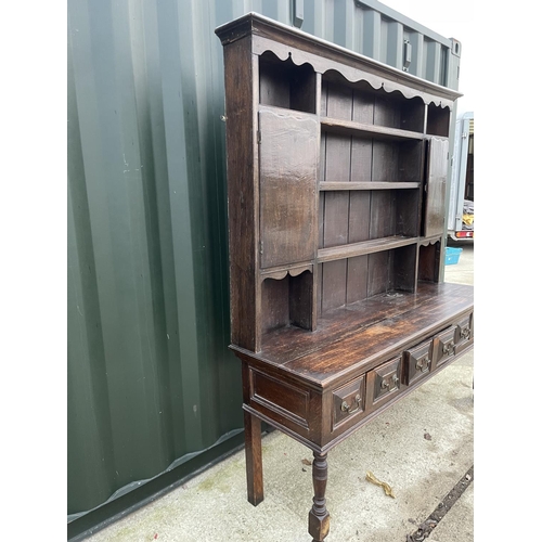 353 - An antique oak three drawer dresser with plate rack back 185x 56x 200