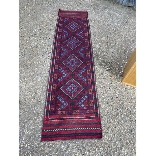 40 - A blue and red pattern runner rug 240x 63