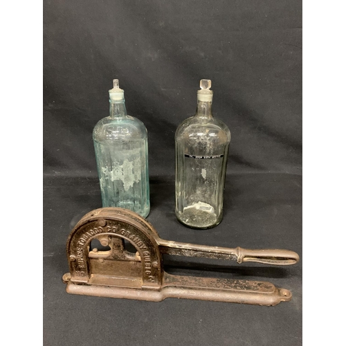 560 - 2 poison bottles, height 36cms and stoppers and tobacco cutter