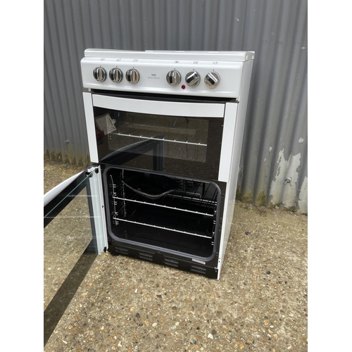 7 - A modern new world electric cooker 55cm wide