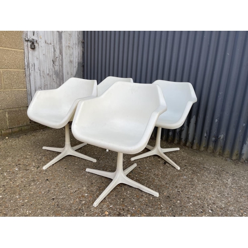 71 - A set of four mid century white swivel chairs, designed by ROBIN DAY and produced in Sweden for Dver... 