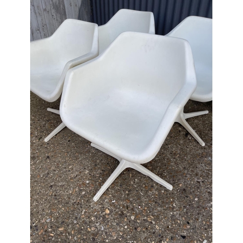 71 - A set of four mid century white swivel chairs, designed by ROBIN DAY and produced in Sweden for Dver... 