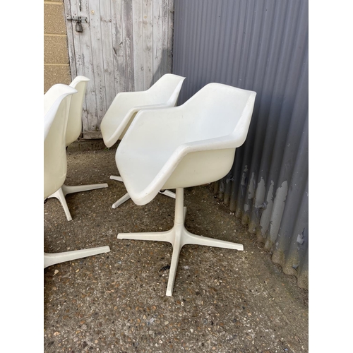 71 - A set of four mid century white swivel chairs, designed by ROBIN DAY and produced in Sweden for Dver... 