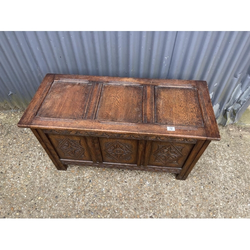 73 - A carved oak three panel coffer 106x 45x 60