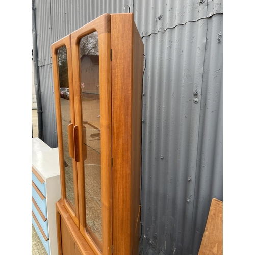 77 - A skoby style teak corner cabinet