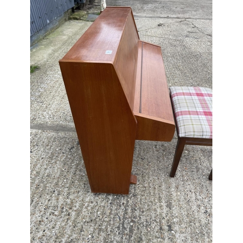 94 - A teak cased Zender piano and stool