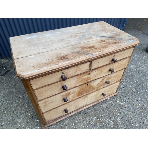 99 - A stripped pine chest of five drawers 118x64x99